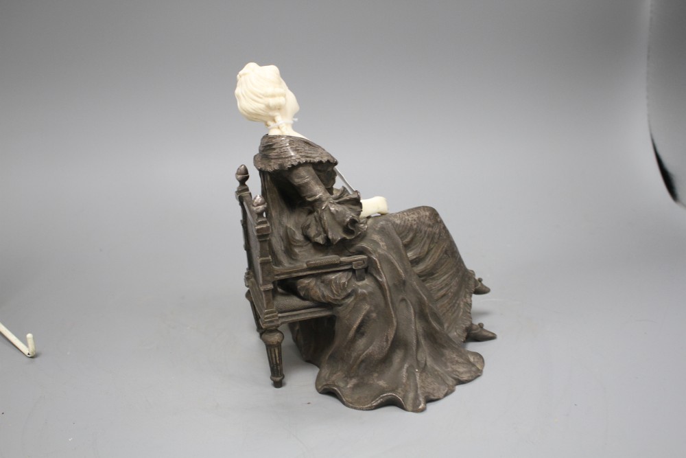 X. Raphanel. An Art Deco silvered bronze and ivory figure of an 18th century lady seated in an armchair, signed, height 19cm, depth 16c